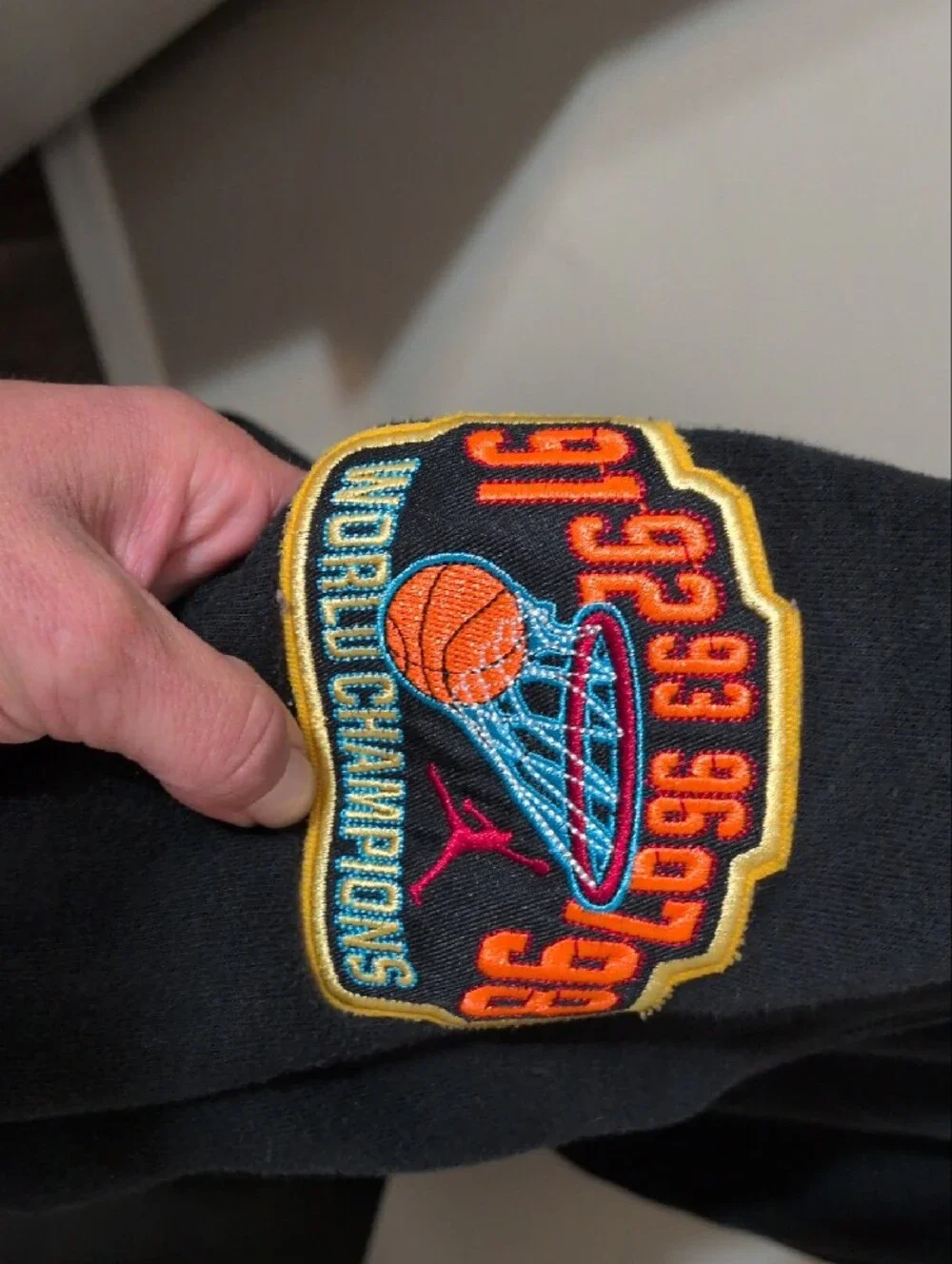 Jordan Black Hooded Sweatshirt with Orange and Blue Logo